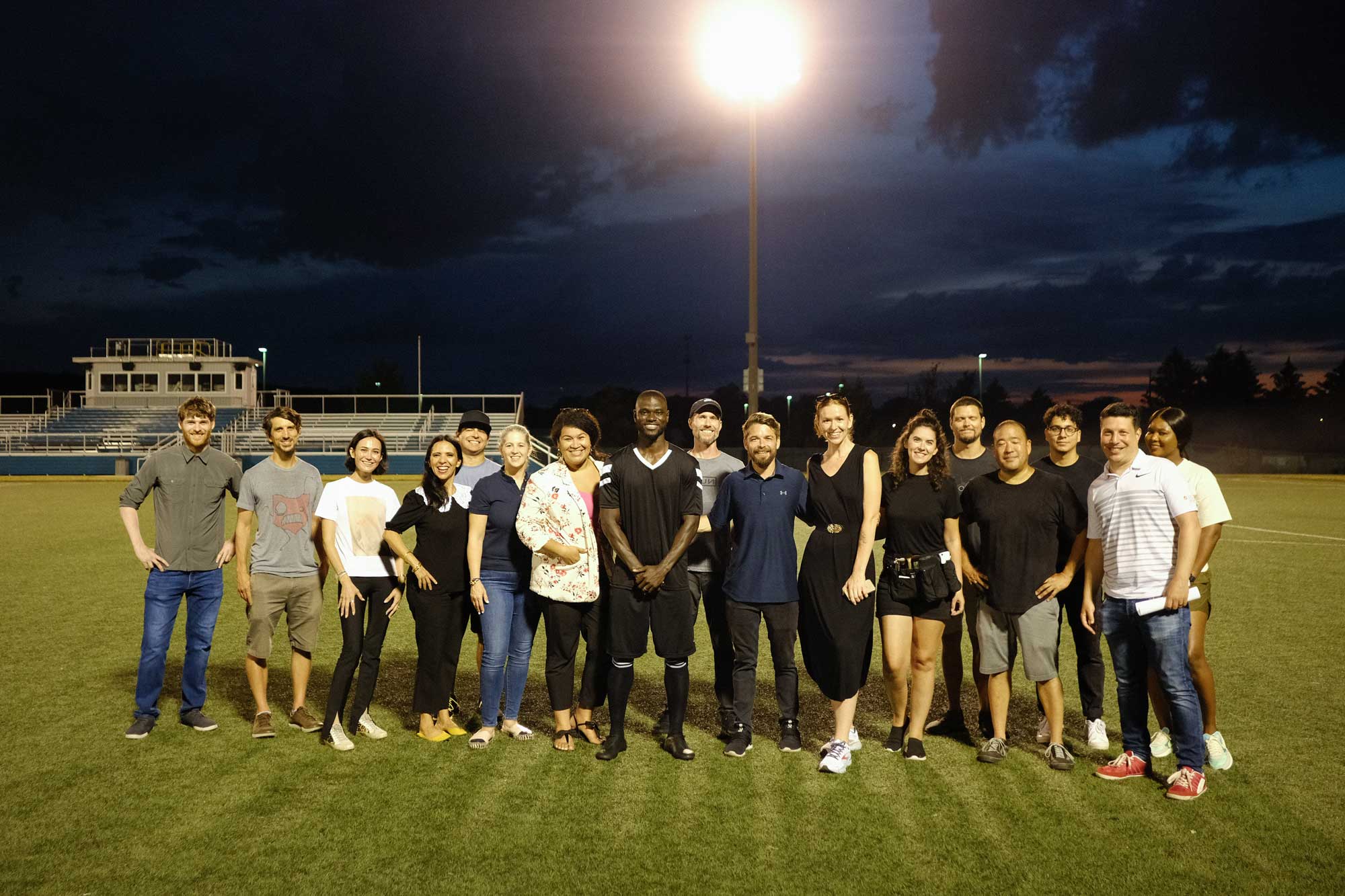 Wrap photo — Doozy Crew with Jonathan Mensah on the Columbus Crew practice field after filming the Boss Money campaign