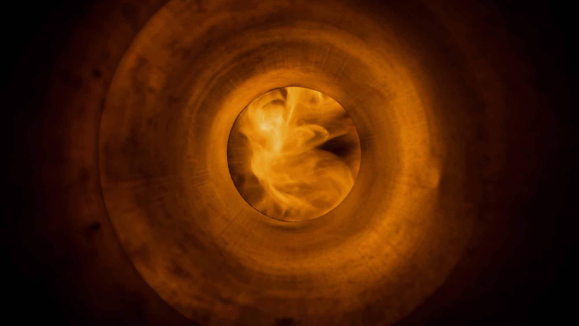 Glowing exhaust closeup — atmospheric still from the Race to Rancho video for YKK AP by Doozy Crew