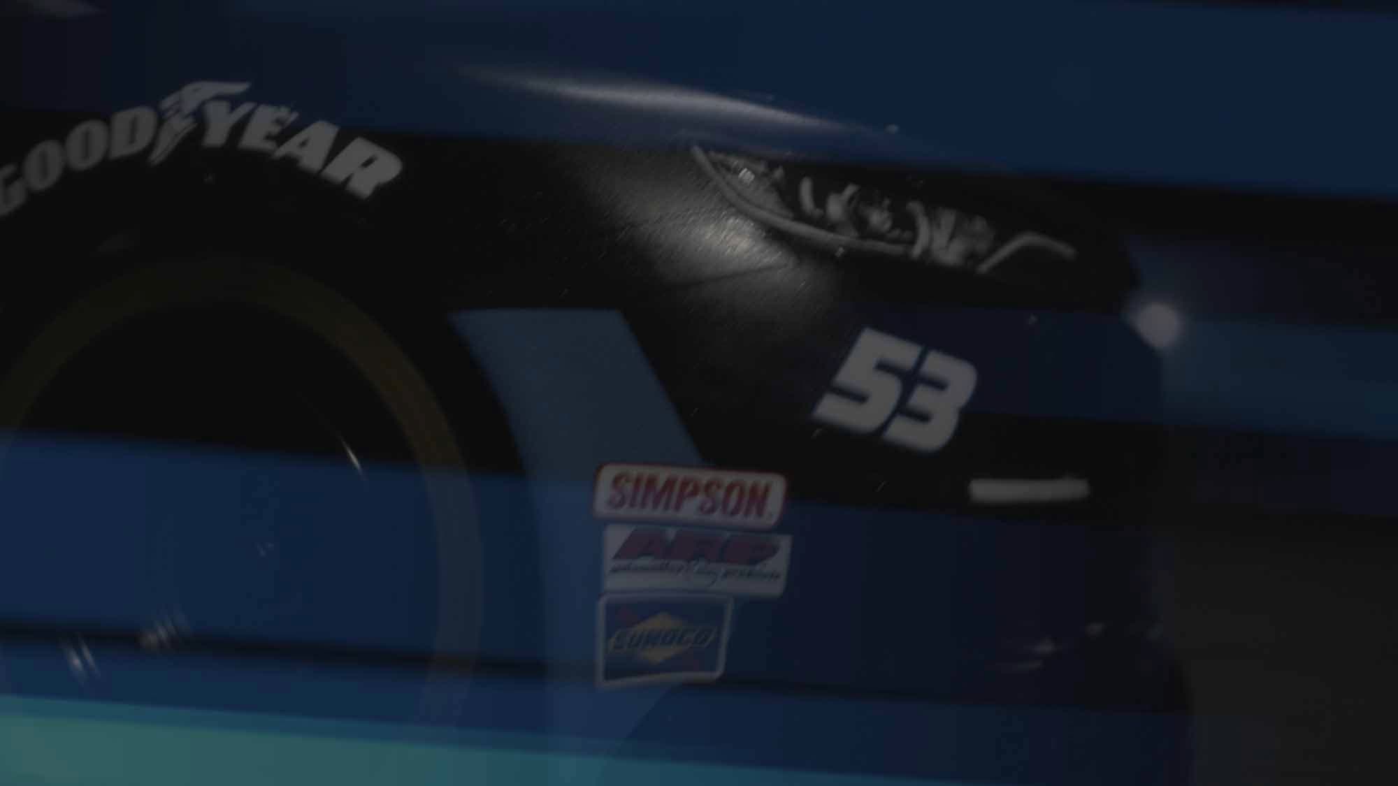 Close-up of the YKK AP #53 NASCAR miniature — Goodyear tire and sponsor decals shot with macro lenses to look full-scale
