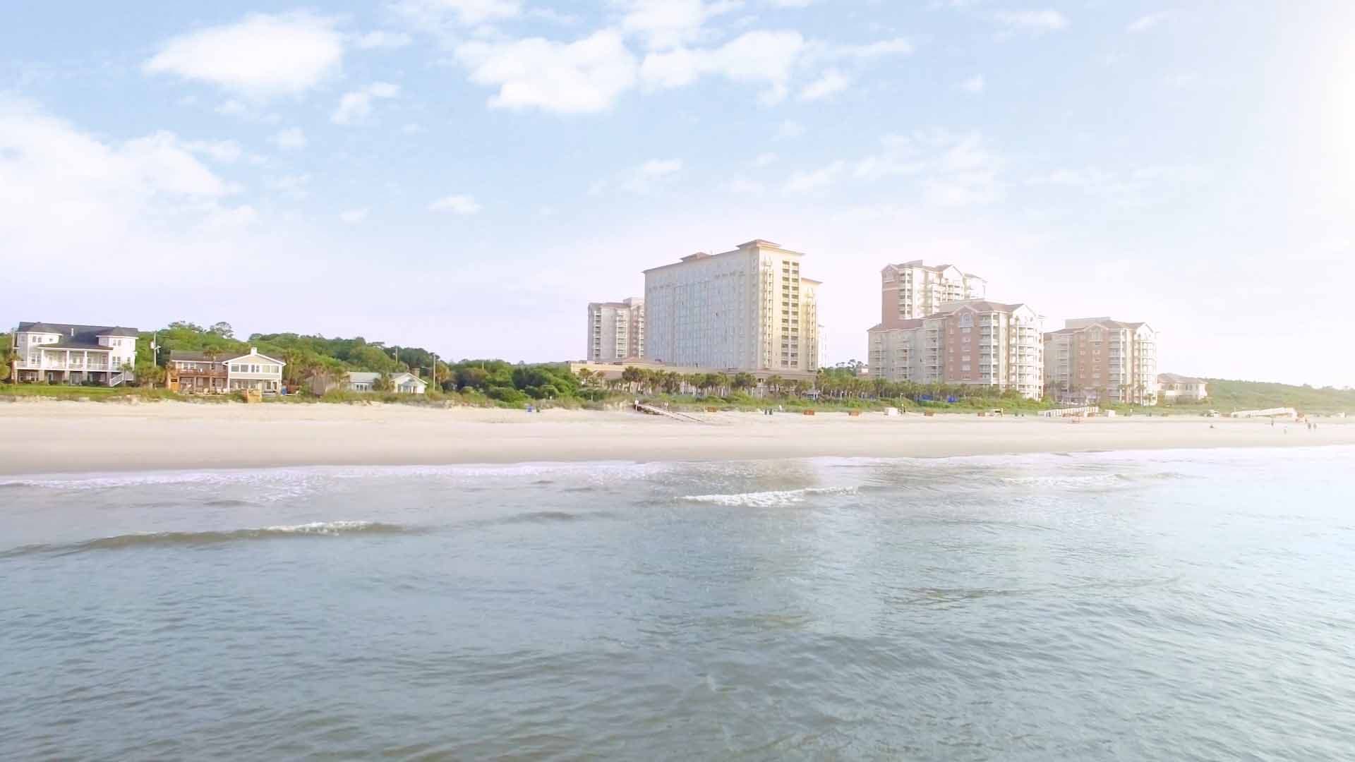 Drone shot from the water looking back at the Myrtle Beach Marriott property